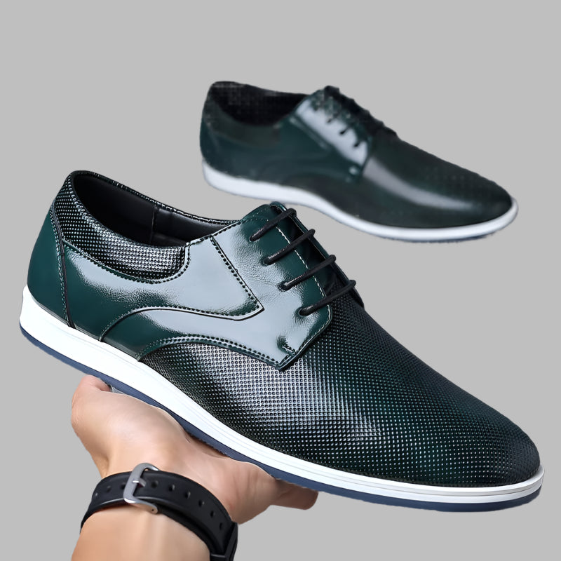 Mens-green-leather-shoes-in-hand